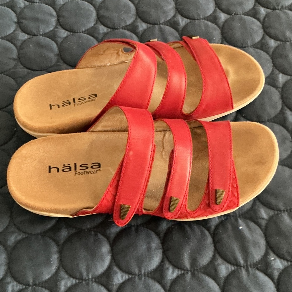 Red sandals with leather upper in good condition
